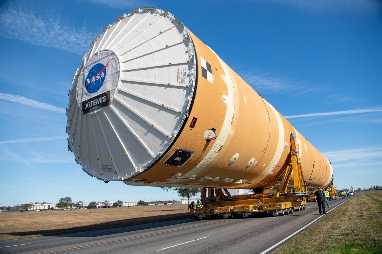 These images show how teams rolled out, or moved, the completed core stage for NASA’s Space Launch System rocket from NASA’s Michoud Assembly Facility in New Orleans. Crews moved the flight hardware for the first Artemis mission to NASA’s Pegasus barge on Jan. 8 in preparation for the core stage Green Run test series at NASA’s Stennis Space Center near Bay St. Louis, Mississippi. Pegasus, which was modified to ferry SLS rocket hardware, will transport the core stage from Michoud to Stennis for the comprehensive core stage Green Run test series. Once at Stennis, the Artemis rocket stage will be loaded into the B-2 Test Stand for the core stage Green Run test series. The comprehensive test campaign will progressively bring the entire core stage, including its avionics and engines, to life for the first time to verify the stage is fit for flight ahead of the launch of Artemis I.  Assembly and integration of the core stage and its four RS-25 engines has been a collaborative, multistep process for NASA and its partners Boeing, the core stage lead contractor, and Aerojet Rocketdyne, the RS-25 engines lead contractor. Together with four RS-25 engines, the rocket’s massive 212-foot-tall core stage — the largest stage NASA has ever built — and its twin solid rocket boosters will produce 8.8 million pounds of thrust to send NASA’s Orion spacecraft, astronauts and supplies beyond Earth’s orbit to the Moon and, ultimately, Mars. Offering more payload mass, volume capability and energy to speed missions through space, the SLS rocket, along with NASA’s Gateway in lunar orbit and Orion, is part of NASA’s backbone for deep space exploration and the Artemis lunar program.